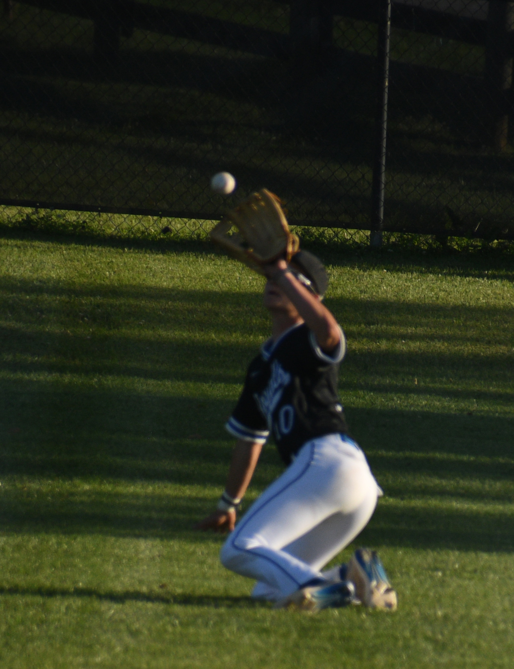 Myles Kern dives to make a catch during the 2024 10th Region basbeall championship game. (photo by Daniel Miller — the Ledger Independent)<