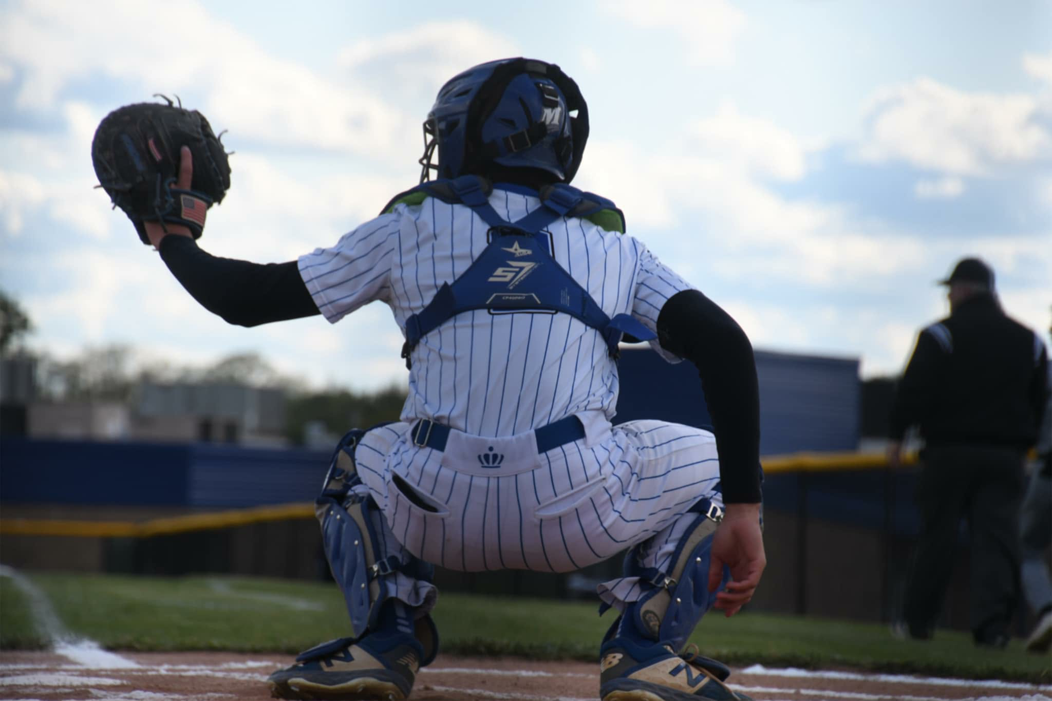 Carson Pugh waits ready behind home plate. (photo by Daniel Miller — the Ledger Independent)